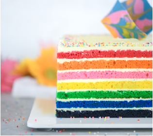 A slice of Dangee Dums rainbow cake